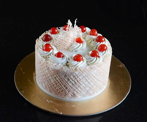 eggless white forest elite cake|Eggless White Forest Cake Video Recipe – Gayathri's Cook Spot.